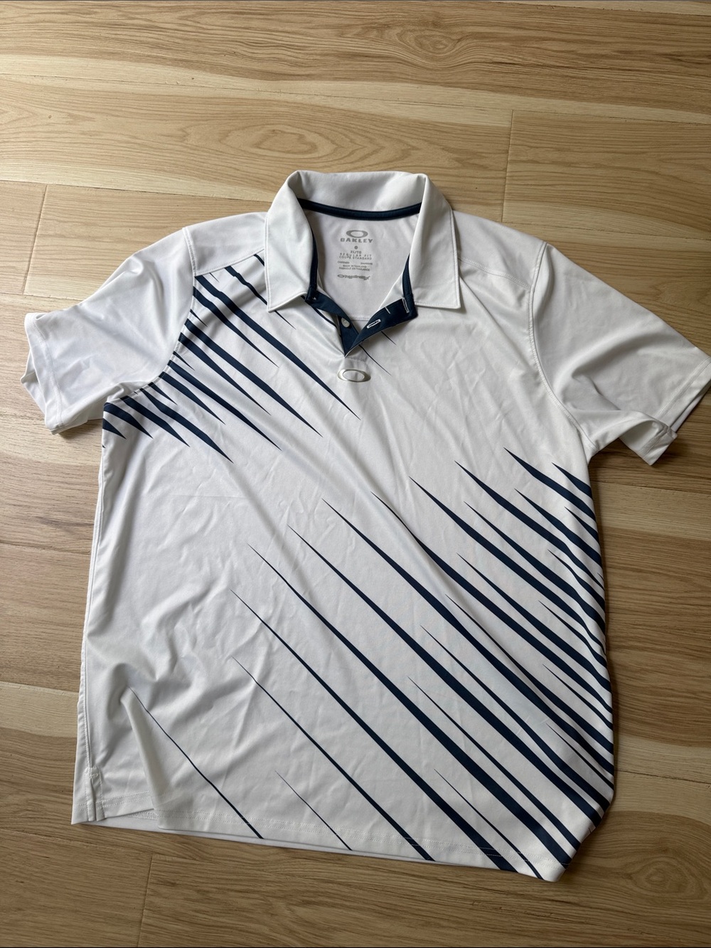 Oakley White Polo with Navy Diagonal Stripe Accents